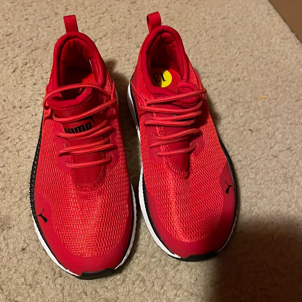 Kids red Puma sneakers